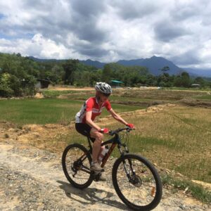 Mountain Biking by Padi Fields in Sabah, Borneo